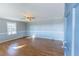 Bright living room with hardwood floors and gray walls at 2555 Klondike Sw Rd, Conyers, GA 30094