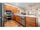 Modern kitchen featuring stainless steel appliances, granite countertops, and ample cabinet space at 320 Jessica Way, Canton, GA 30114