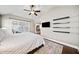 Comfortable main bedroom with a ceiling fan and a TV, and lots of natural light at 320 Jessica Way, Canton, GA 30114