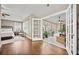 Bright main bedroom with hardwood floors leading to a sunroom at 320 Jessica Way, Canton, GA 30114