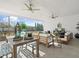 Covered patio with wooden furniture and ceiling fans at 401 Nettle Ct, Woodstock, GA 30188