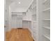 Large walk-in closet with ample shelving and drawers at 401 Nettle Ct, Woodstock, GA 30188