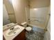 Bathroom features a shower over tub and tile floors and a large vanity mirror at 4547 Carriage Park Dr, Lithonia, GA 30038