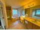 Primary bathroom features large tub with shower and dual sinks at 4547 Carriage Park Dr, Lithonia, GA 30038