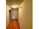 View of the hallway with hard wood flooring at 4547 Carriage Park Dr, Lithonia, GA 30038