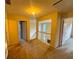 Upstairs hallway with a view of the foyer below and 3 doors at 4547 Carriage Park Dr, Lithonia, GA 30038