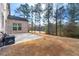 Expansive backyard with a large patio and mature trees, perfect for outdoor entertaining at 5269 Heron Bay Blvd, Locust Grove, GA 30248