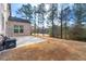 Spacious backyard with patio, offering a private and wooded view at 5269 Heron Bay Blvd, Locust Grove, GA 30248