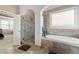 Spa-like bathroom with walk-in shower and a soaking tub at 5269 Heron Bay Blvd, Locust Grove, GA 30248