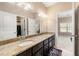 Bathroom with granite countertops, double sinks, and a view of the bedroom at 5269 Heron Bay Blvd, Locust Grove, GA 30248