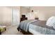 Bedroom with neutral paint, a bed, and a TV on top of a dresser at 5269 Heron Bay Blvd, Locust Grove, GA 30248