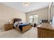 Bedroom featuring neutral tones, carpet flooring, and natural light at 5269 Heron Bay Blvd, Locust Grove, GA 30248