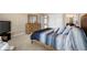 Bright bedroom featuring a large bed, neutral walls, and carpet flooring at 5269 Heron Bay Blvd, Locust Grove, GA 30248