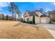 A three car garage with a mix of brick and siding adds visual interest to this home at 5269 Heron Bay Blvd, Locust Grove, GA 30248