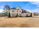 Elegant brick facade with mature trees and landscaping at 5269 Heron Bay Blvd, Locust Grove, GA 30248