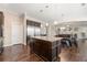 Spacious kitchen featuring stainless steel appliances, granite countertops, and island with bar seating at 5269 Heron Bay Blvd, Locust Grove, GA 30248