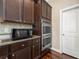Close up of kitchen featuring granite countertops, tile backsplash, and stainless steel appliances at 5269 Heron Bay Blvd, Locust Grove, GA 30248