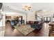 Expansive living area with hardwood flooring, open layout connecting to the kitchen and entryway at 5269 Heron Bay Blvd, Locust Grove, GA 30248