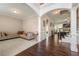 Bright living room with hardwood floors, decorative columns, and natural light at 5269 Heron Bay Blvd, Locust Grove, GA 30248