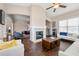 Open living room featuring hardwood floors and a fireplace at 5269 Heron Bay Blvd, Locust Grove, GA 30248