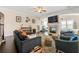 Spacious living room featuring a fireplace, plush seating, and hardwood floors for a cozy atmosphere at 5269 Heron Bay Blvd, Locust Grove, GA 30248