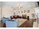 Living room with hardwood floors, cozy seating, and a view of the staircase at 5269 Heron Bay Blvd, Locust Grove, GA 30248