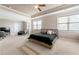 Large main bedroom with a neutral color scheme, abundant natural light, and open layout at 5269 Heron Bay Blvd, Locust Grove, GA 30248