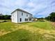 Expansive backyard featuring newly laid sod, offering ample space for outdoor activities and leisure at 679 Crest Line Trl, Powder Springs, GA 30127