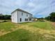 Newly sodded lawn in the backyard of a two story house with covered patio at 679 Crest Line Trl, Powder Springs, GA 30127