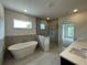 Bathroom with a soaking tub, and glass door shower with modern tile at 679 Crest Line Trl, Powder Springs, GA 30127