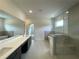 Bathroom featuring double vanity, a glass door shower and soaking tub at 679 Crest Line Trl, Powder Springs, GA 30127