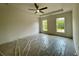 The main bedroom features two windows and a ceiling fan for your comfort at 679 Crest Line Trl, Powder Springs, GA 30127