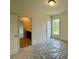 Spacious bedroom with a window and ensuite bathroom, offering convenience and privacy at 679 Crest Line Trl, Powder Springs, GA 30127