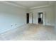 Bedroom with a tray ceiling and double doors that lead to the kitchen at 679 Crest Line Trl, Powder Springs, GA 30127