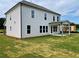 Exterior view of the house with a covered patio and freshly sodded lawn at 679 Crest Line Trl, Powder Springs, GA 30127