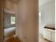 Hallway that is unfinished with an open doorway to another room and a vanity on the right at 679 Crest Line Trl, Powder Springs, GA 30127