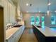 Kitchen with a long island, white cabinets, and modern appliances that create a functional and stylish space at 679 Crest Line Trl, Powder Springs, GA 30127