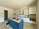 Contemporary kitchen showcasing a stylish blue island, custom cabinets, and efficient layout at 679 Crest Line Trl, Powder Springs, GA 30127