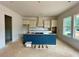 Modern kitchen with a large island, custom cabinets, and abundant natural light from the windows at 679 Crest Line Trl, Powder Springs, GA 30127