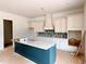 Bright kitchen features a large island, custom cabinets, and a stylish backsplash at 679 Crest Line Trl, Powder Springs, GA 30127