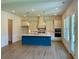 Kitchen with a central island, modern cabinets, and stainless steel appliances, designed for cooking and entertaining at 679 Crest Line Trl, Powder Springs, GA 30127