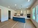 Modern kitchen with a stylish island, stainless steel appliances, and ample natural light at 679 Crest Line Trl, Powder Springs, GA 30127