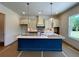 Kitchen with blue island, pendant lighting, stylish tile backsplash, and ample counter space at 679 Crest Line Trl, Powder Springs, GA 30127