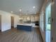 Modern kitchen with a blue island, quartz countertops, stainless steel appliances and eat in area at 679 Crest Line Trl, Powder Springs, GA 30127