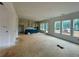 Open floor plan showcasing the kitchen with a blue island and large windows at 679 Crest Line Trl, Powder Springs, GA 30127