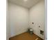 An empty laundry room is ready for customization to meet your storage and washing needs at 679 Crest Line Trl, Powder Springs, GA 30127