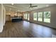 Expansive living room with an open floor plan, and light-filled views from the windows at 679 Crest Line Trl, Powder Springs, GA 30127