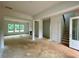 Spacious, light-filled living room with fireplace and staircase, offering a versatile layout at 679 Crest Line Trl, Powder Springs, GA 30127