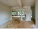 Open-concept living room with bright light coming from windows and a fireplace at 679 Crest Line Trl, Powder Springs, GA 30127
