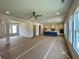 Spacious living area connects kitchen, dining, and fireplace with natural light, ready for personalization at 679 Crest Line Trl, Powder Springs, GA 30127
